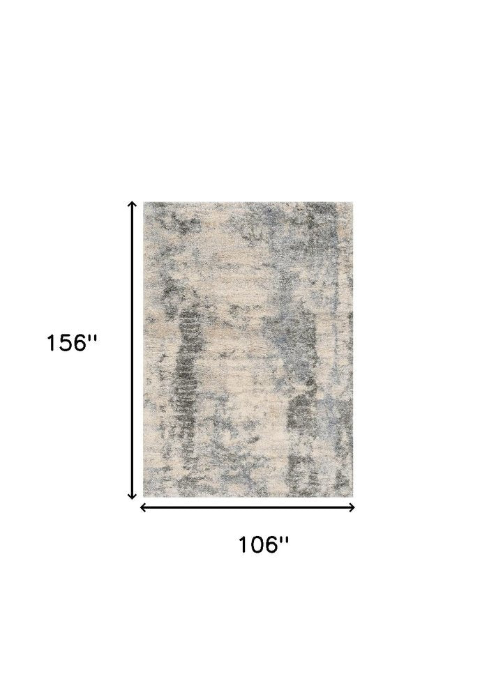 9' X 13' Ivory And Blue Abstract Area Rug