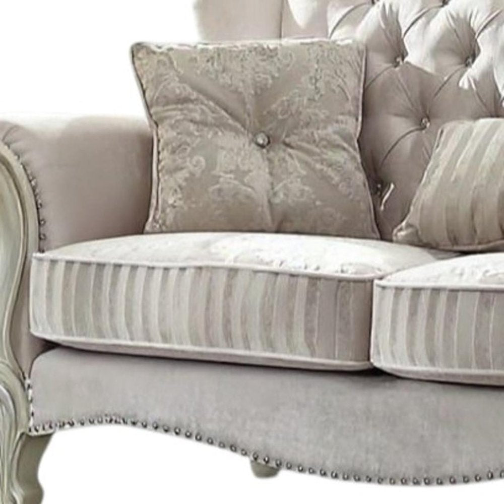Loveseat curvo de piel sintética color hueso y dorado de 70"