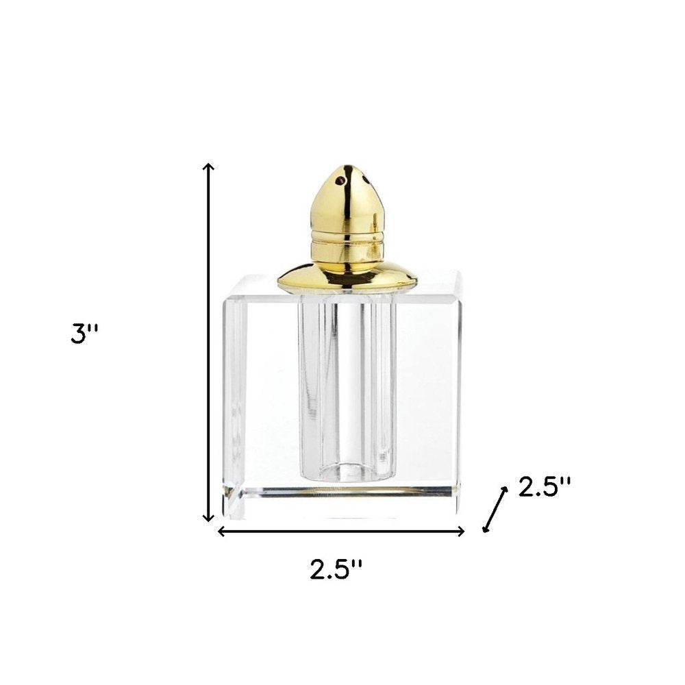 Juego de dos pimenteros de cristal transparente y dorado