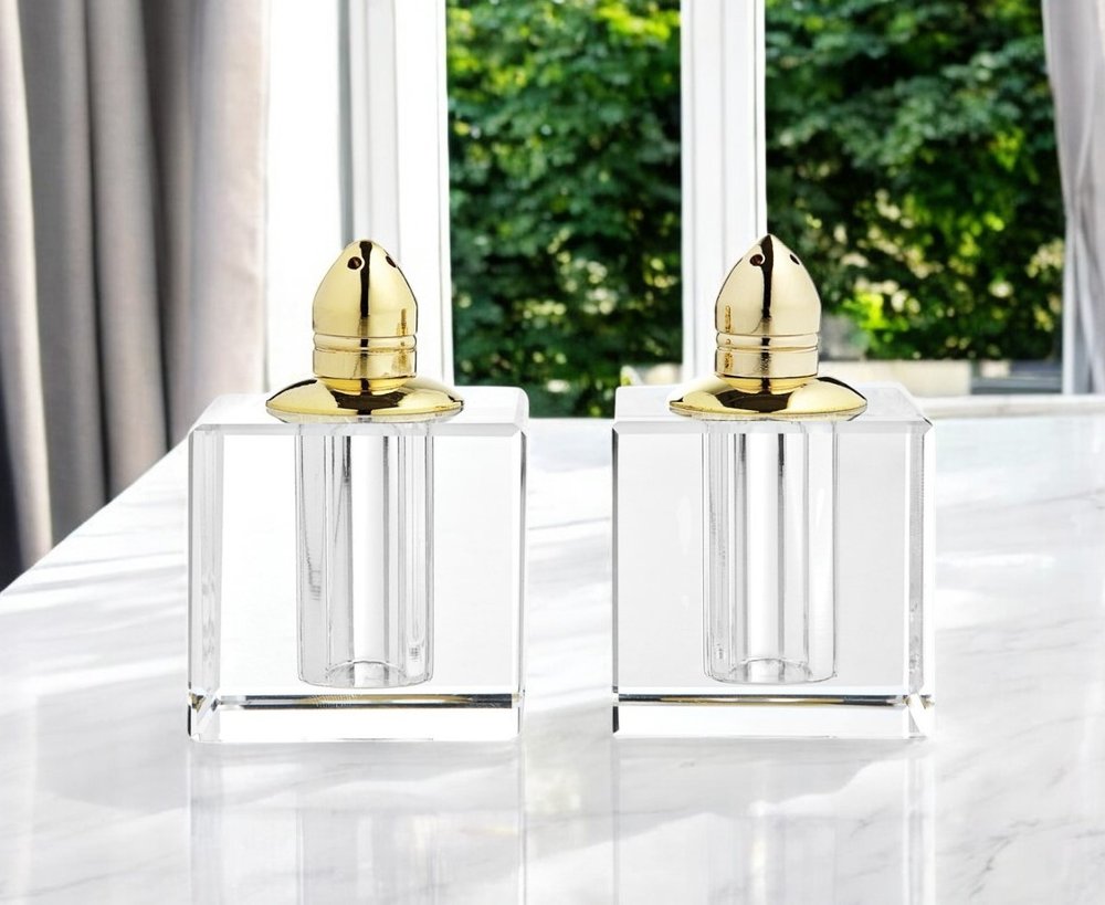 Juego de dos pimenteros de cristal transparente y dorado