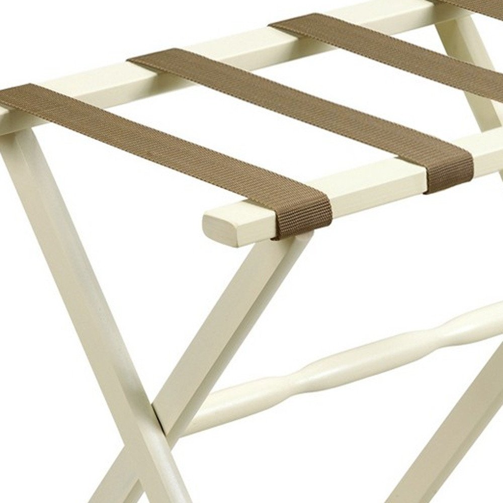 Portaequipajes plegable de madera con acabado marfil y correas color canela para hotel