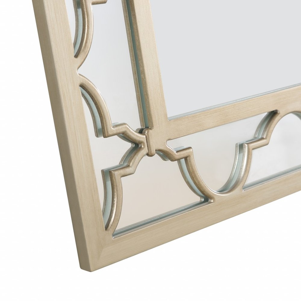 Espejo decorativo con marco de metal color champán de 44"