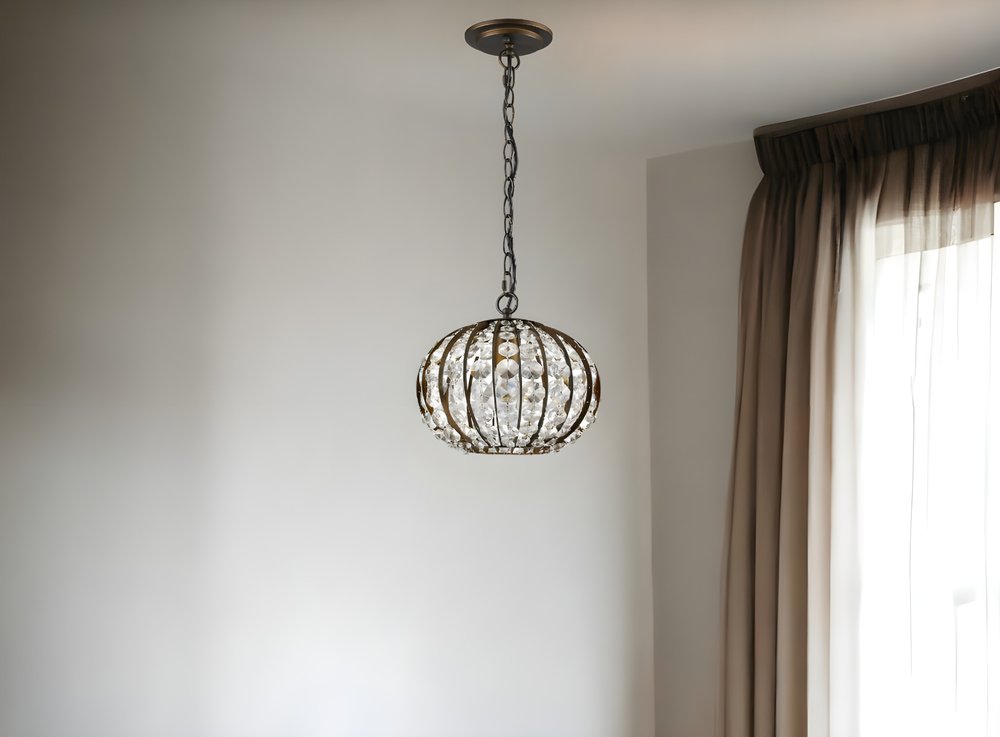 Lámpara colgante Olivia de una luz con forma de globo de cristal en bronce frotado con aceite