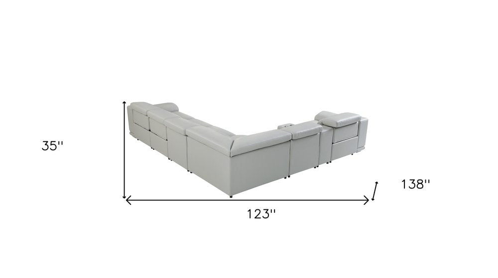 Seccional esquinero de siete piezas en forma de U, reclinable eléctrico, de cuero italiano gris claro con consola