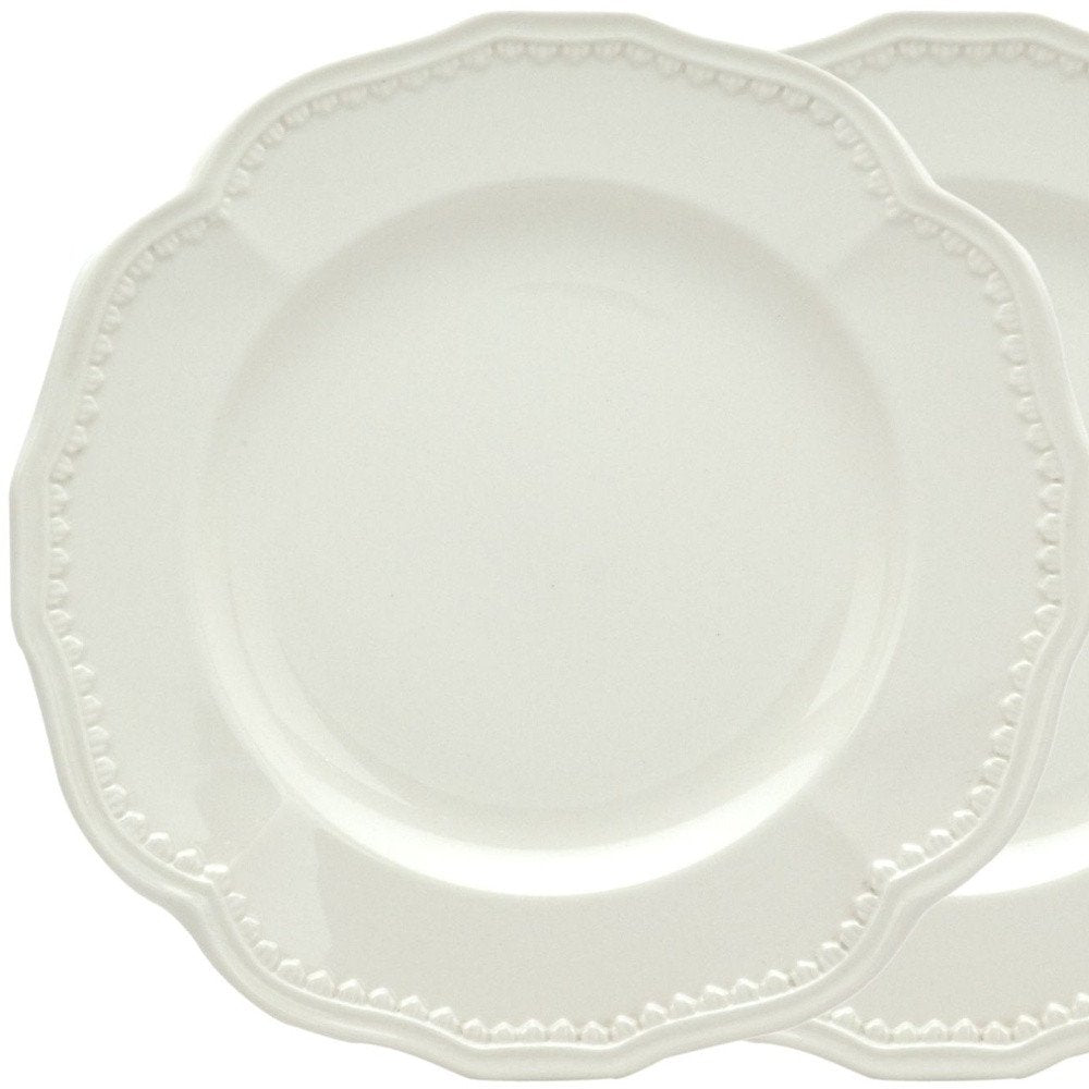Juego de cuatro platos de ensalada de cerámica blanca redonda con diseño festoneado para cuatro personas