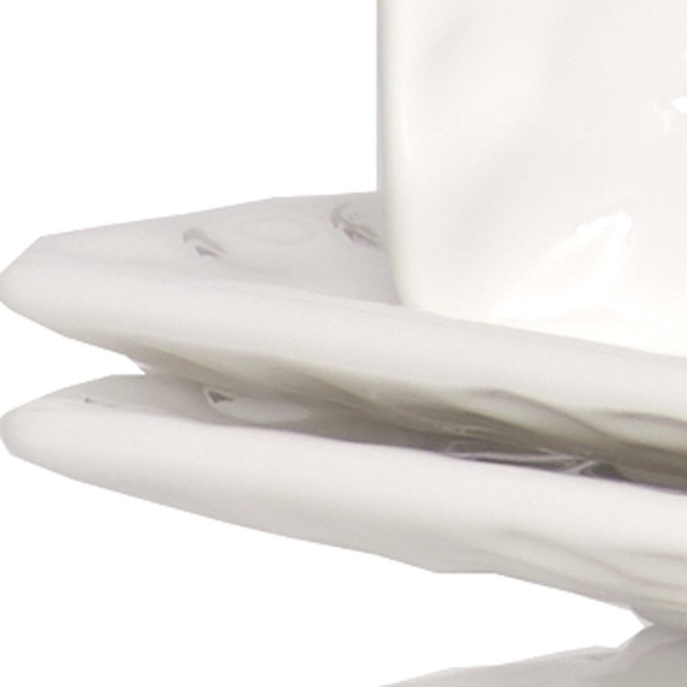 Juego de seis platos de ensalada de porcelana blanca rectangular con diseño de guijarros.