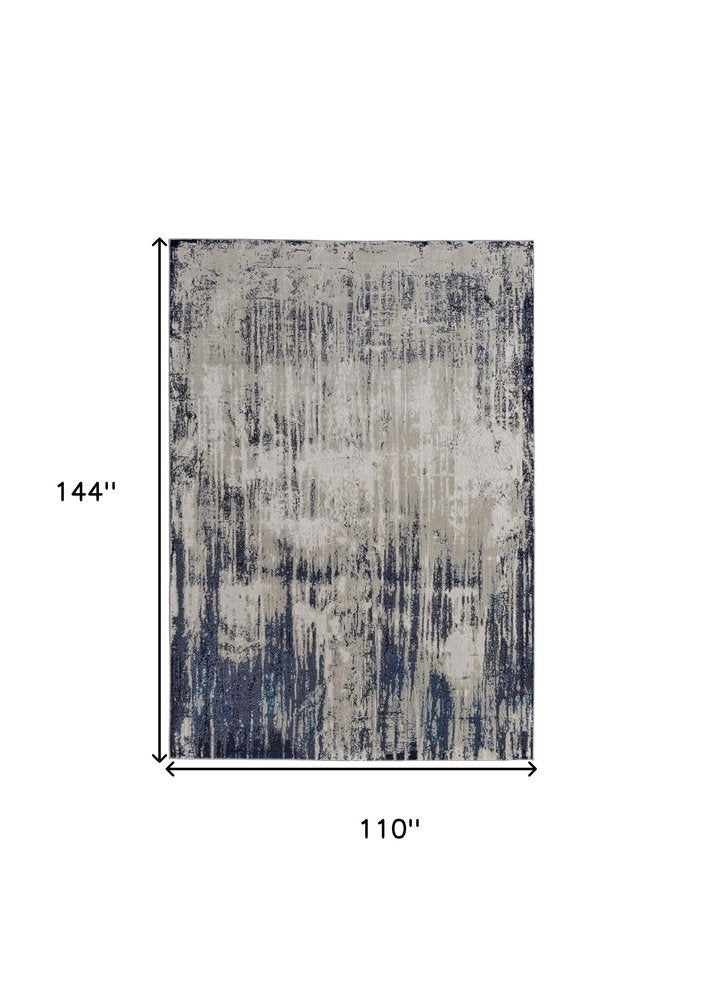 9' X 12' Tan Blue And Ivory Abstract Power Loom Distressed Area Rug