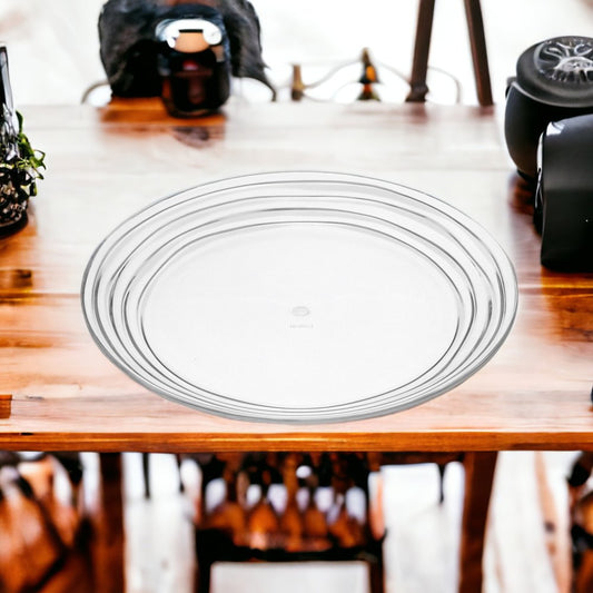 Juego de cuatro platos de ensalada acrílicos redondos transparentes con espirales.