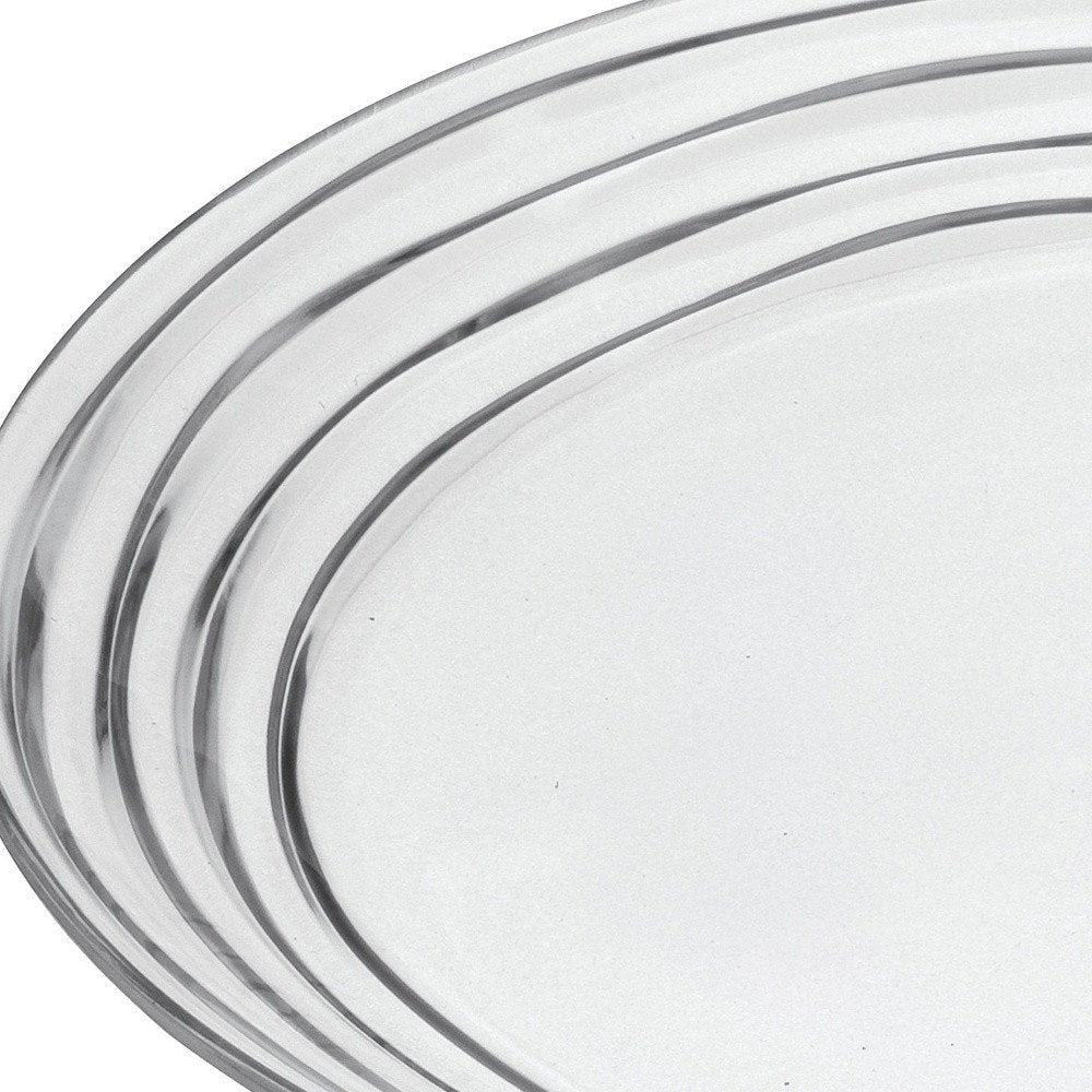Juego de cuatro platos de cena de acrílico transparente con espirales redondos.
