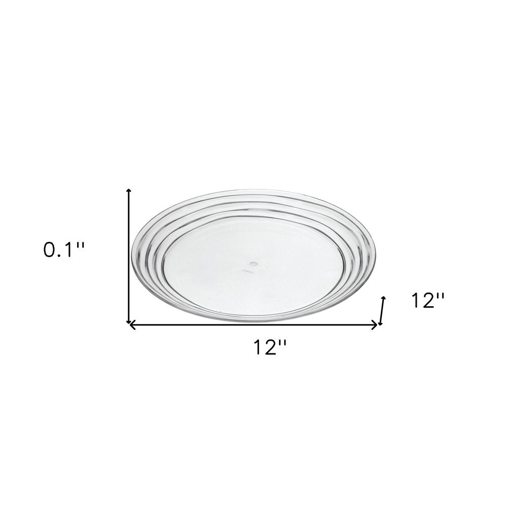 Juego de cuatro platos de cena de acrílico transparente con espirales redondos.