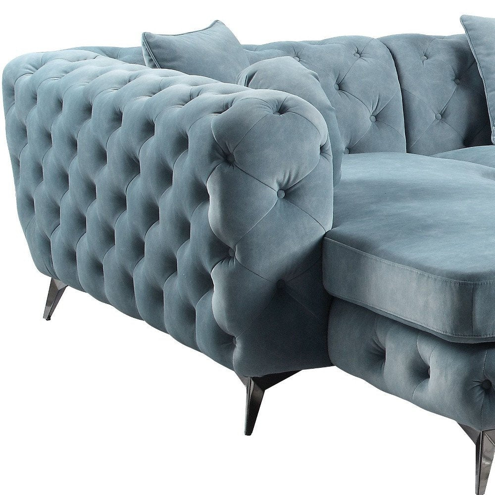 Conjunto de tres piezas de cuero verde oscuro en forma de U con cojines y asiento.