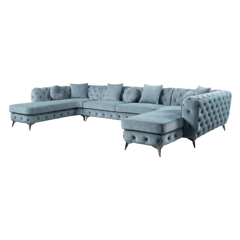 Conjunto de tres piezas de cuero verde oscuro en forma de U con cojines y asiento.