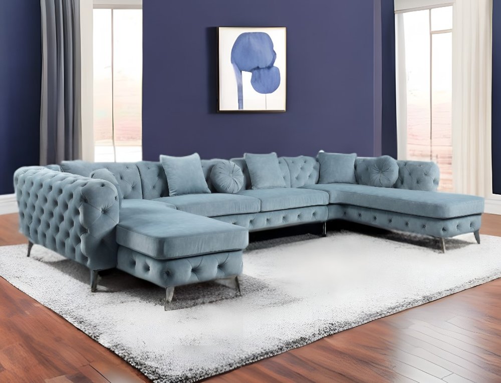 Conjunto de tres piezas de cuero verde oscuro en forma de U con cojines y asiento.