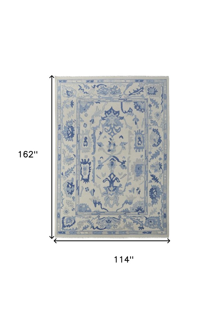 9' X 13' Ivory and Blue Wool Floral Hand Knotted Area Rug With Fringe
