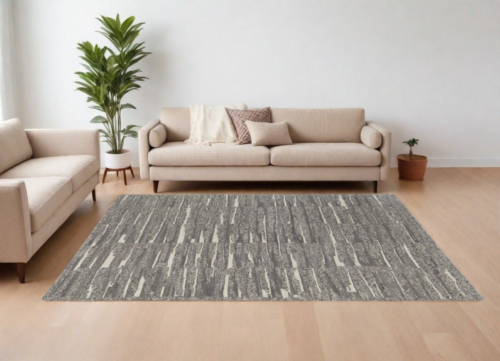 9' X 13' Gray Ivory and Taupe Abstract Hand Woven Area Rug