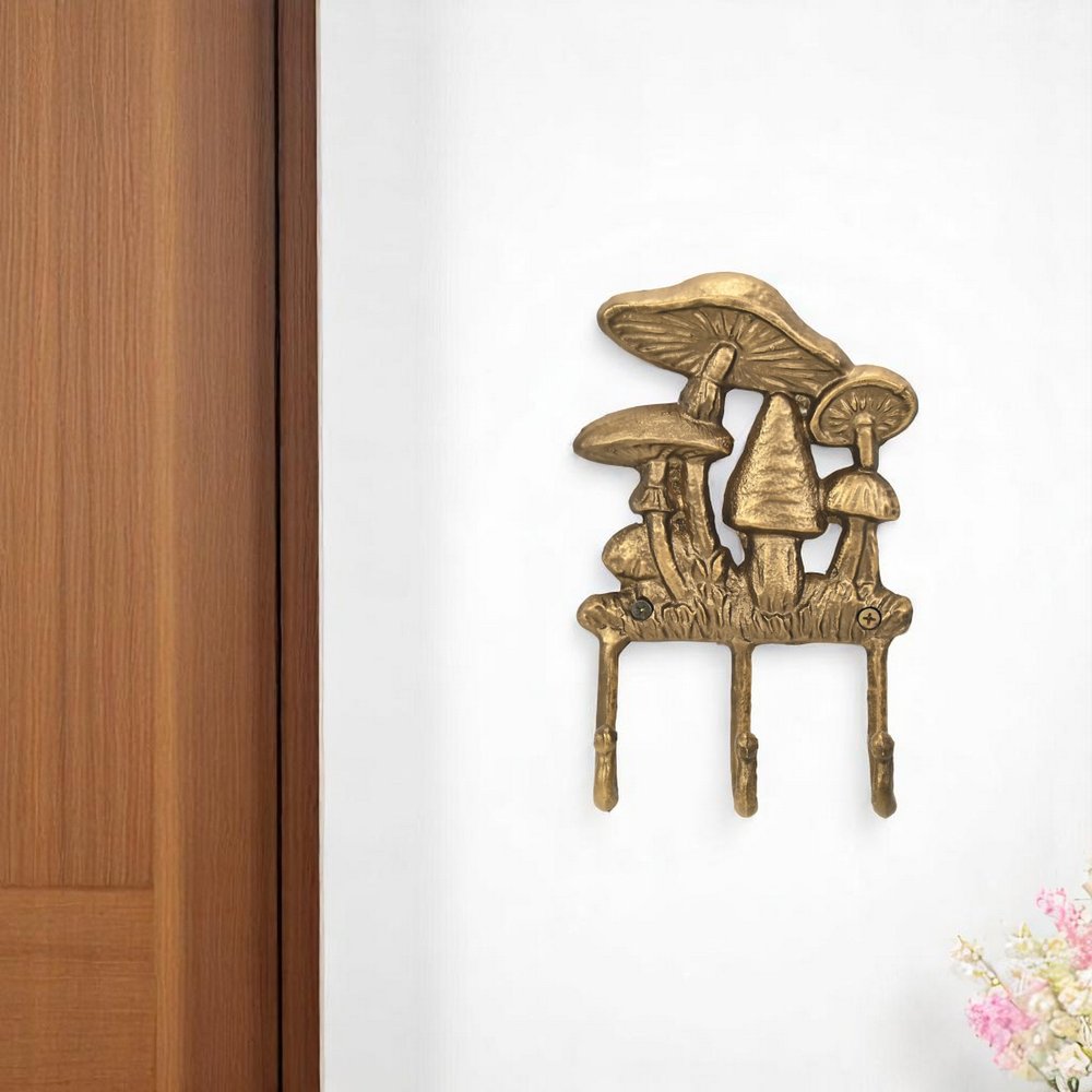 Perchero de pared de hierro fundido con tres ganchos y diseño de hongo, de 5" y dorado envejecido