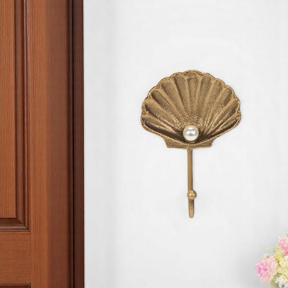 Gancho de pared de hierro fundido dorado de 4" con forma de concha marina