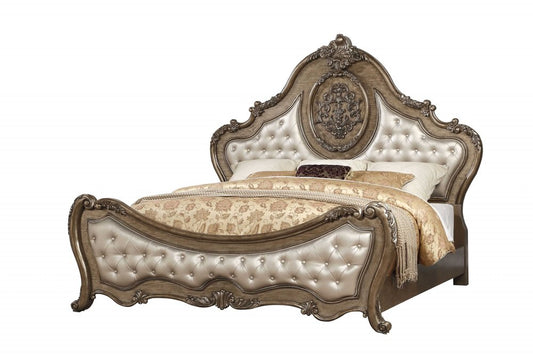 Cama Queen con capitoné de piel sintética tapizada en bronce y ribete de tachuelas