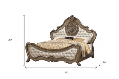 Cama Queen con capitoné de piel sintética tapizada en bronce y ribete de tachuelas