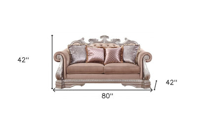 Loveseat de terciopelo color champán de 80" y cojines decorativos