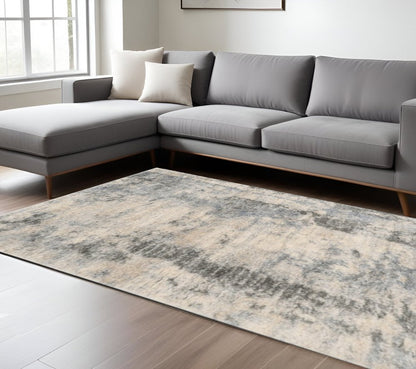 9' X 13' Ivory And Blue Abstract Area Rug