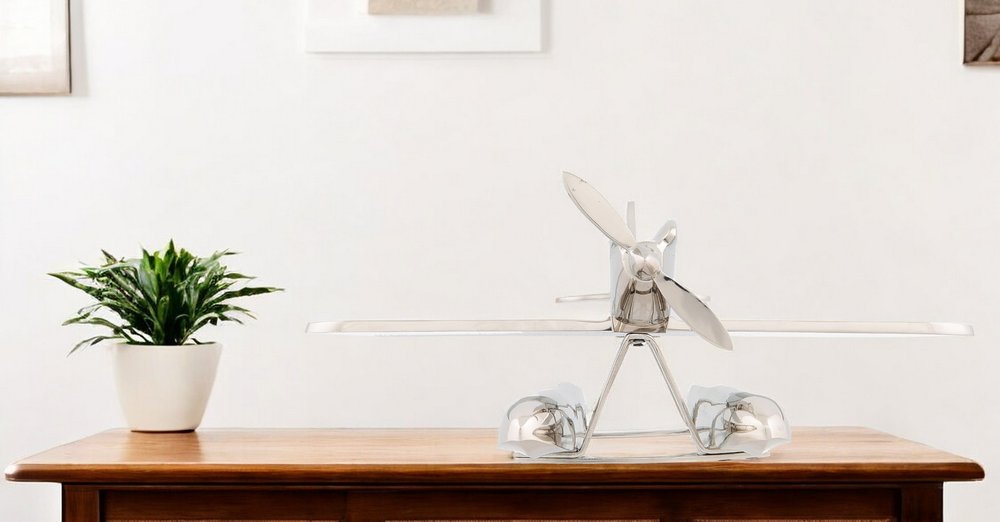 Escultura de sobremesa de avión a escala de 7" en metal niquelado, pintada a mano