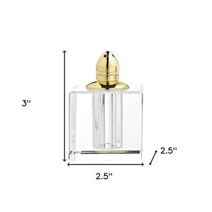 Juego de dos pimenteros de cristal transparente y dorado