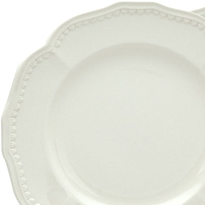 Juego de cuatro platos de ensalada de cerámica blanca redonda con diseño festoneado para cuatro personas