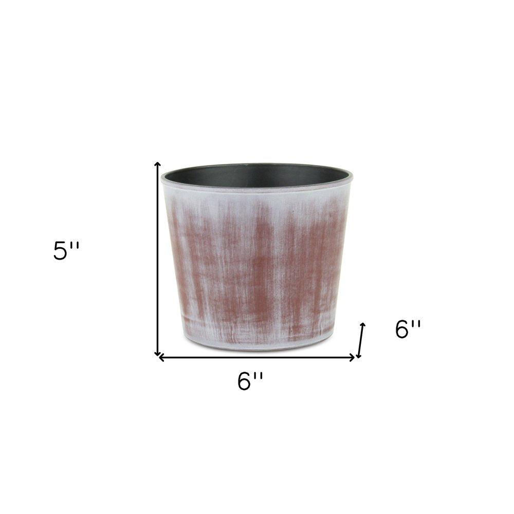 Maceta redonda de plástico reciclado de 15 cm, con textura en tonos marrones y marfil, para interior y exterior.