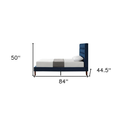 Cama individual de madera maciza azul marino con tapizado de terciopelo capitoné