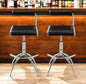 Set of Two Black and Silver Faux Leather and Metal Low Back Adjustable Height Bar Chairs
