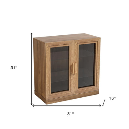 Gabinete decorativo de 31" con puerta de vidrio natural y transparente y tres estantes