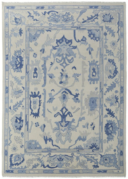 9' X 13' Ivory and Blue Wool Floral Hand Knotted Area Rug With Fringe