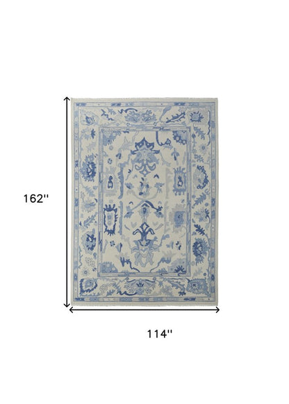 9' X 13' Ivory and Blue Wool Floral Hand Knotted Area Rug With Fringe