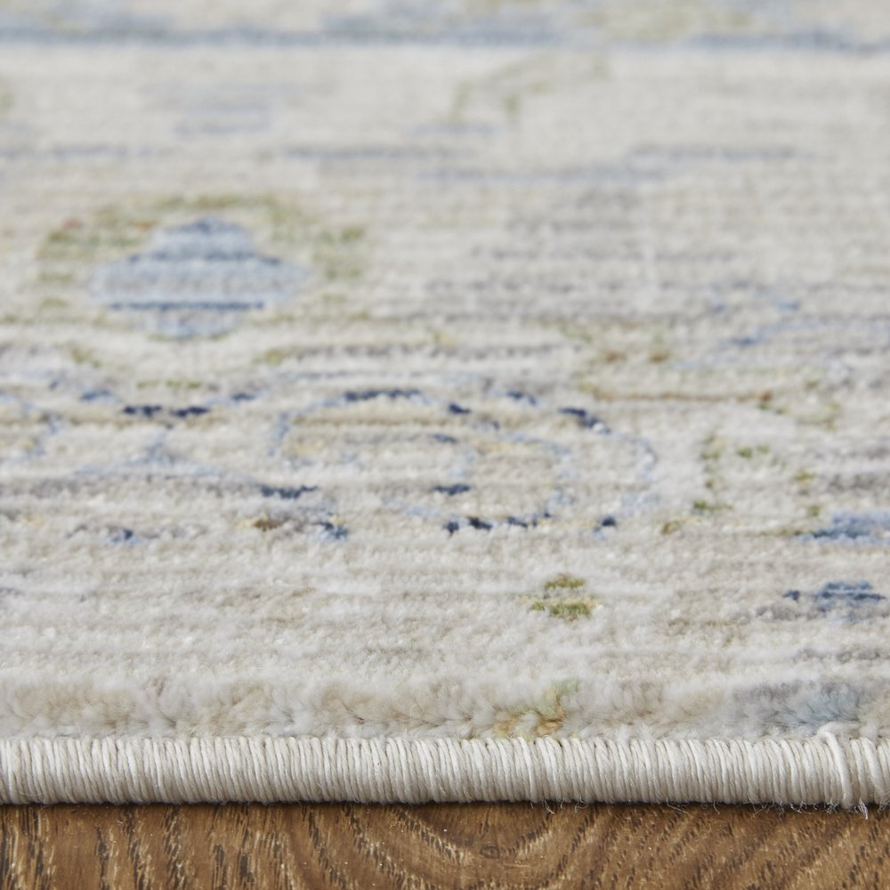 9' X 13' Ivory Green and Blue Abstract Power Loom Worn Faded Area Rug