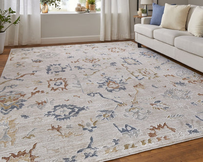 9' X 13' Ivory Blue and Gold Floral Power Loom Worn Faded Area Rug With Fringe