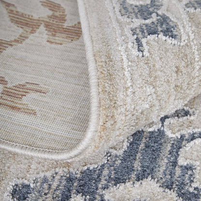 9' X 13' Ivory Blue and Gold Floral Power Loom Worn Faded Area Rug With Fringe