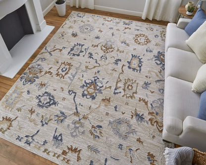 9' X 13' Ivory Blue and Gold Floral Power Loom Worn Faded Area Rug With Fringe
